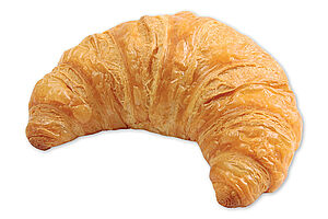 Vorgegarte französisches Buttercroissant einer goldbraunen Krust und einer lockeren, ungleichmäßigen Porung.